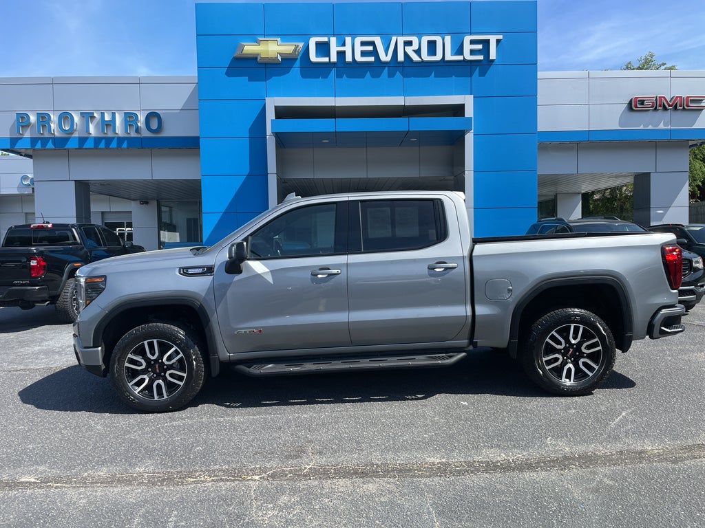 2024 GMC Sierra 1500 AT4 in Sterling Metallic — front three-quarter view